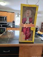 Full view of Wendy Walker doll in original yellow window box on countertop