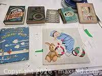 Top view showing five books and painting on table