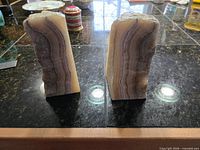 front polished faces showing banding of both onyx bookends