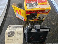 Camera front with box and instruction leaflet