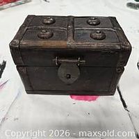 Three-quarter view showing full exterior, top panel design and clasp lock