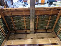 Interior showing woven bamboo pattern and depth measurement with ruler