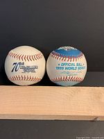 Front logos of both baseballs: 70th Midsummer Classic and Official Ball 1999 World Series