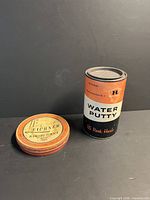 Overall view of both tins – Water Putty and Leichner Blending Powder