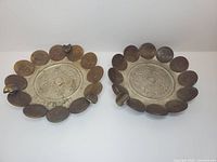 Top view of both ashtrays showing calendar design and coin rims