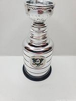 Full view of chrome-finish mini Stanley Cup showing bowl, barrel, and base