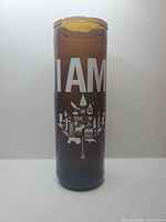 Front view of amber upcycled beer glass with "I AM" design