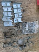 Group shot showing all fence hardware pieces on wood surface