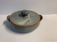 Top view of gray glazed stoneware casserole dish with lid and side handles
