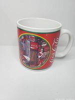 Front and side view of Coca-Cola 1970-1980 era ceramic mug