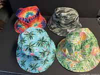 Top view of all four bucket hats showing patterns