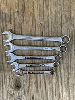 Group shot of all five imperial combination wrenches to show sizes and overall wear
