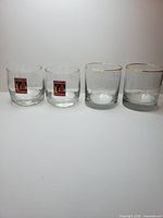 Four cocktail glasses, two Grand Marnier two Tia Maria