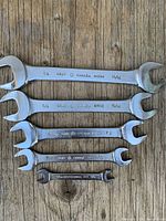 All five Gray Tools open-end wrenches laid out to show sizes and markings