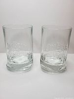 Pair of Jim Beam whiskey glasses front view showing logo