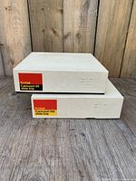 Two Kodak Carousel slide tray boxes, 80 and 140 capacity stacked