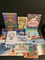 Overview of assorted children’s books including Summer’s Child, Pup and Dragon, and others