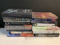 Front view of two stacks of fifteen new fiction books