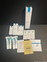 All skincare samples arranged: La Roche-Posay Effaclar box, three La Roche-Posay boxes, three Vichy boxes, three La Roche-Posay tubes, Nuxe, Uriage and Littifree sachets