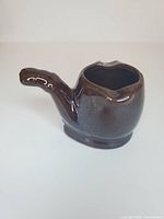 Side profile showing complete pipe shape and glaze