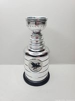 Front view of silver-tone mini Stanley Cup with San Jose Sharks logo