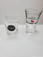 Square and tall Bacardi shot glasses side by side