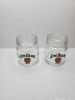 Front view of both Jim Beam miniature jar shot glasses