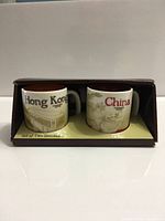 Boxed set showing both Hong Kong and China mugs