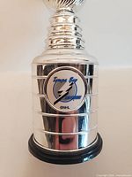 Front detail of Tampa Bay Lightning logo on mini Stanley Cup