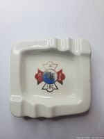 Top view of ceramic ashtray showing IOF L.B.C. crest and molded rests