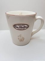 Front view of Tim Hortons Limited Edition No. 3 cream ceramic mug