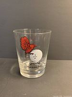 Front view showing cardinal, golf ball graphic, and brand text