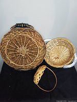 Three wicker baskets grouped together