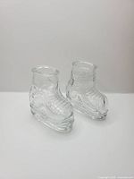 Two Windsor skate-shaped shot glasses front view