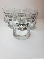 Five of the Wiser's Small Batch glasses visible, showing logo and shape.