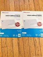 Front view of two sealed Office Depot return address label packs showing size and quantity details
