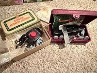 Zigzagger in box with cams and Buttonholer in maroon case with templates visible