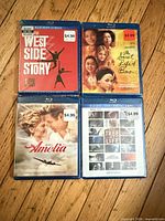 Front covers of the four sealed Blu-ray movies