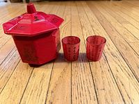 Dish with lid on and two cups front view