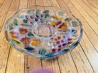 Overhead view of entire round five-section glass platter with painted fruit