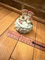 Front view of Dreamsicles trinket box with ruler showing approx 3 in width