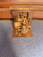 Front view of copper piano player sculpture