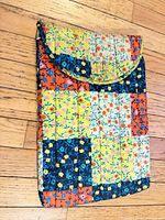 Full view of quilted floral laptop sleeve front
