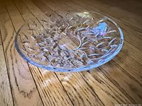Top angled view of entire crystal dish showing leaf pattern and depth