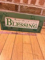 Front view of plaque showing full quote and green border