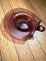 Top view of cranberry glass dish showing color and shape