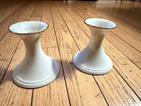 Front angle of both candlestick holders showing shape and color