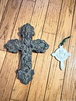 Front view of both crosses showing details and size comparison