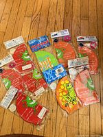 All nine packaged silicone swim caps displayed on floor