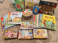 Group shot showing books, puzzle boxes, maze board and tins